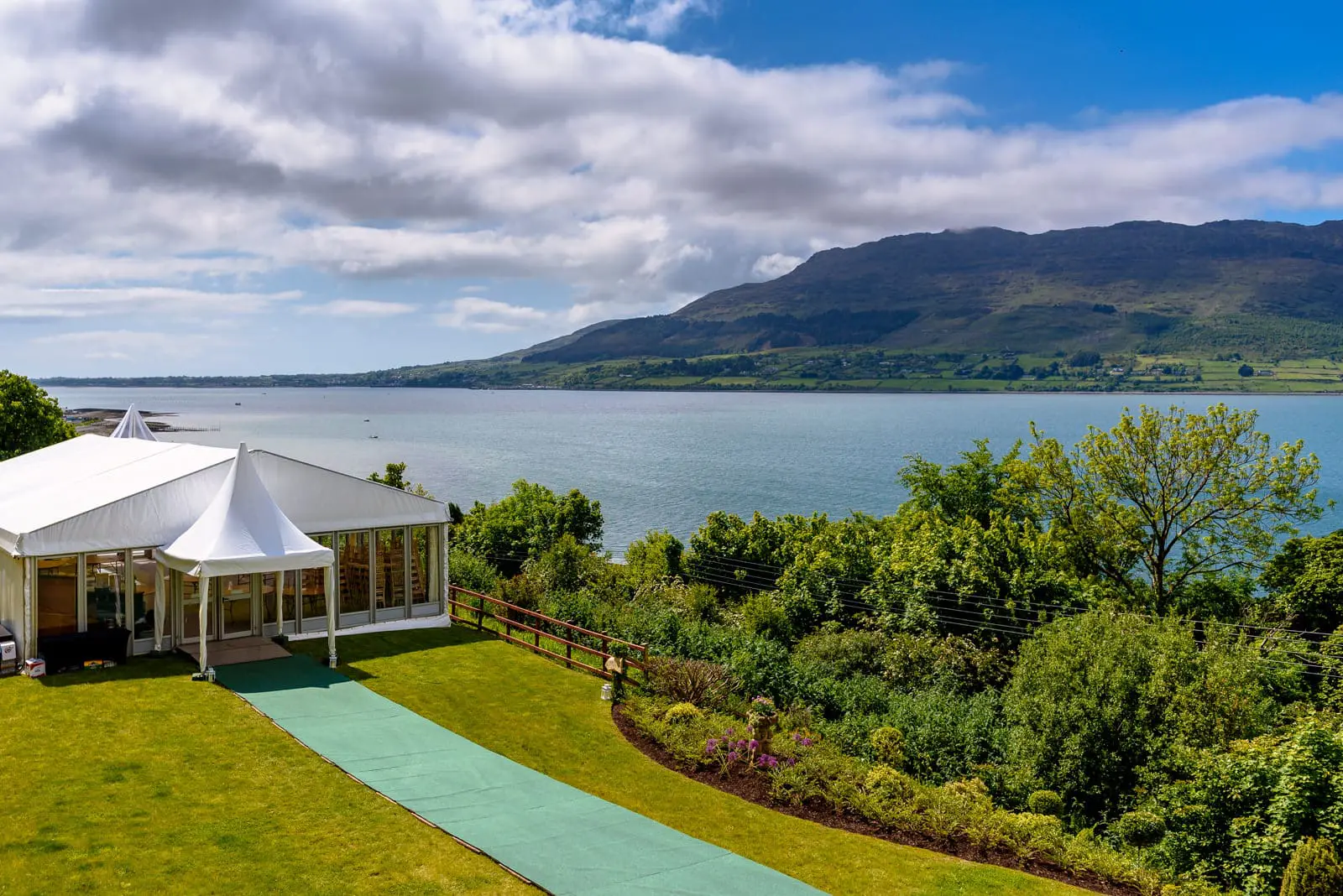 Montalto House,Zoe Flood & Keith Moloney, Gorgeous marquee set up for wedding celebrations overlooking the sea end County Down Northern Ireland